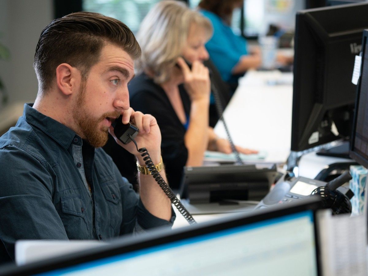 Employees on the phone at New Age Logistics