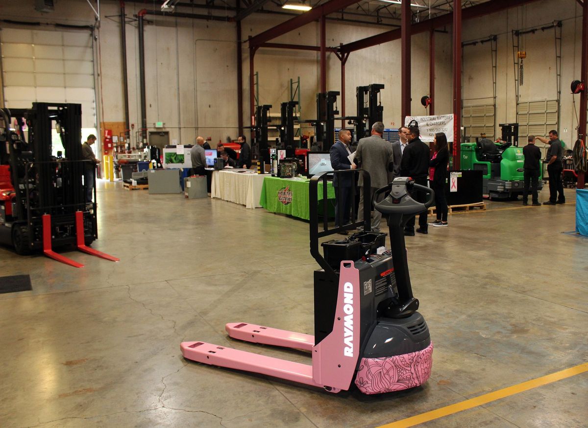 RAYMOND HANDLING RAISES $17,328 TO BENEFIT BREAST CANCER CHARITIES