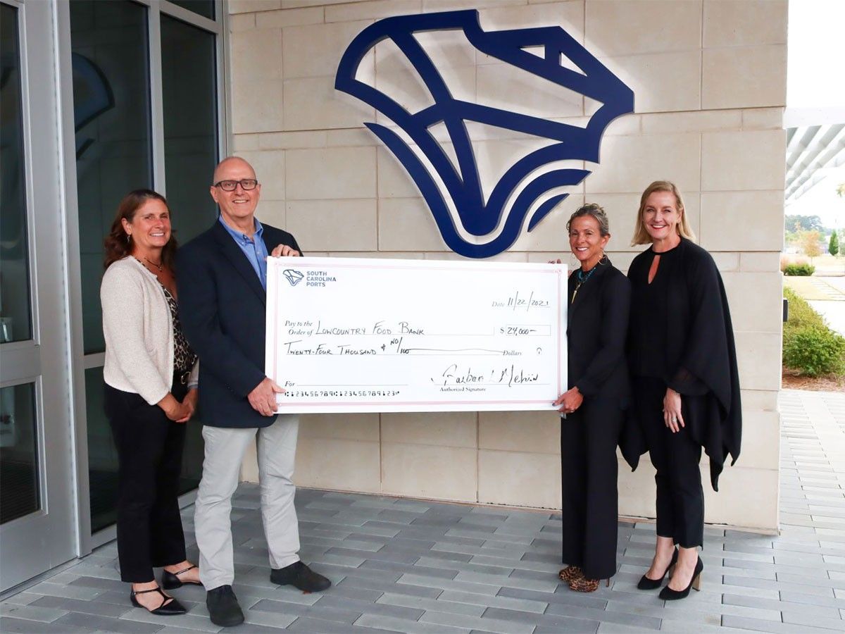 People in front of South Carolina Ports building with giant check