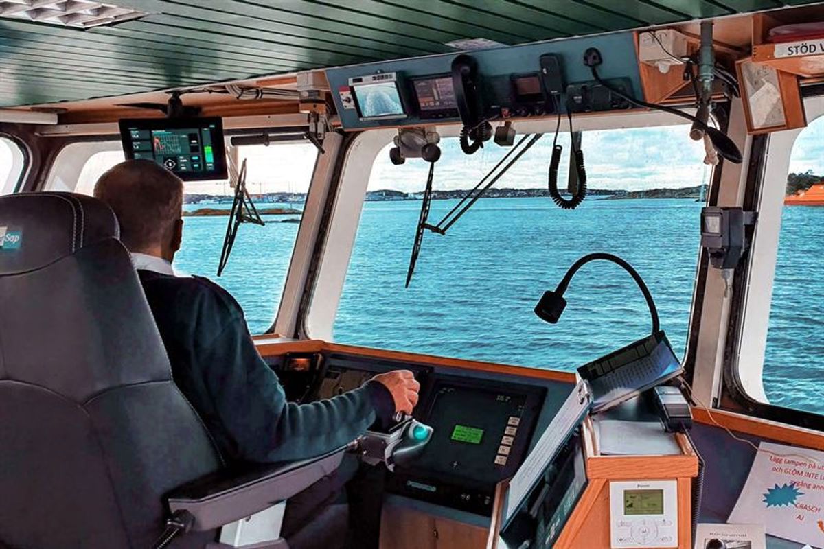 Person driving ferry looking out at water