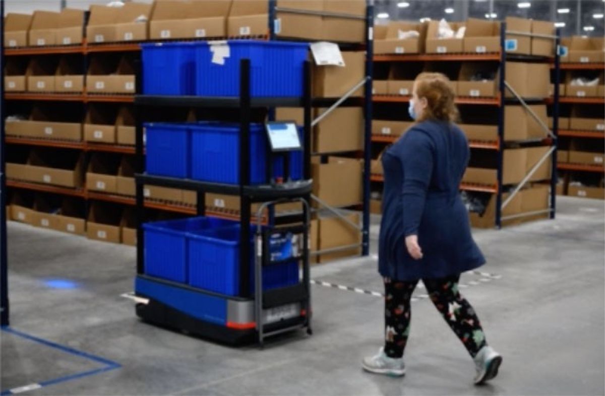 Worker in Crocs warehouse